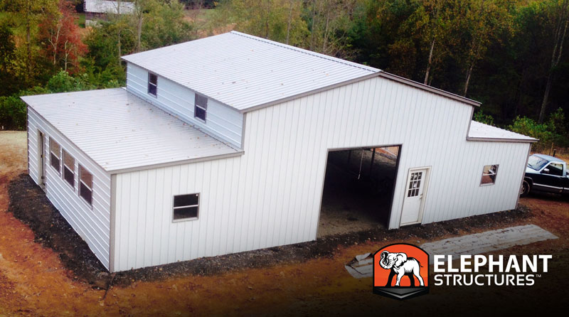Metal building Ridgeline barn with fully enclosed lean to's and many windows.