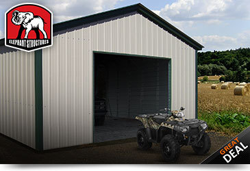 ATV storage garage, white sides and green trim.