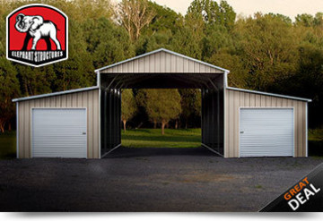 Ridgeline style metal barn with two closed lean-to's and roll-up garage doors on each.