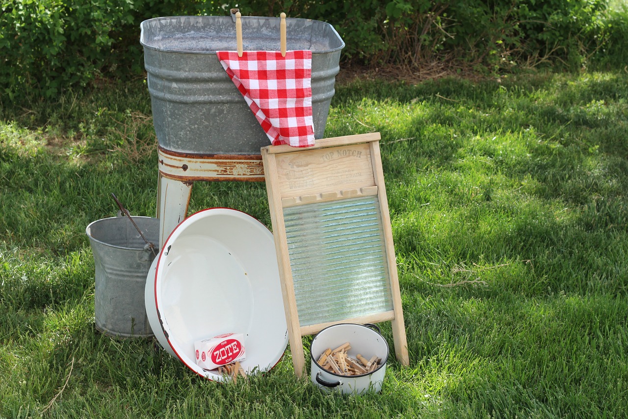 washboard, tub, and clothes line pins